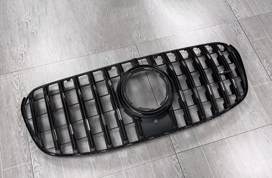 Uninstalled gloss black AMG GT style Panamericana front grille replacement for the facelifted 2024-2026 Mercedes Benz GLS450 and GLS580 X167, featuring factory camera and emblem cutouts.