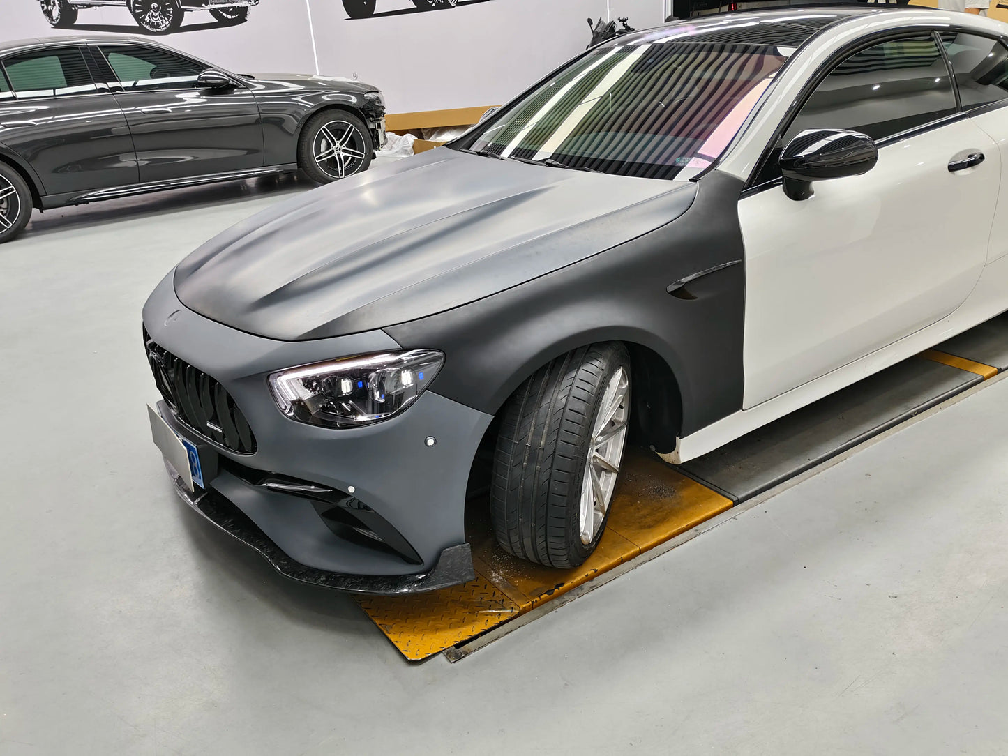 Mercedes E350 Coupe 2021-2023 W213 converted with E63 AMG style wide body kit front three quarter view